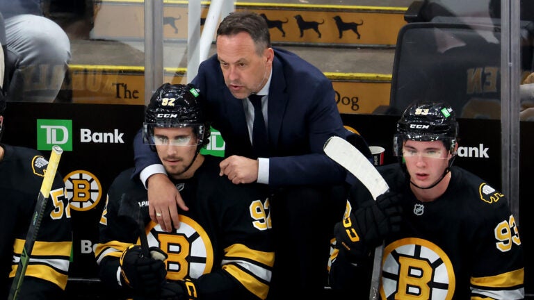 Bruins coach Maco Sturm talks to forward Marat Khusnutdinov during the second period against the Sabres TD Garden on Saturday, October 11, 2025.