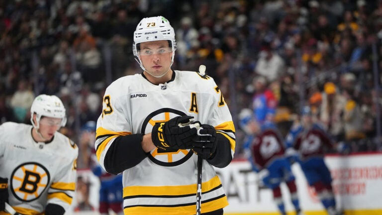 Boston Bruins defenseman Charlie McAvoy (73) in the third period of an NHL hockey game Saturday, Oct. 18, 2025, in Denver.