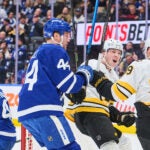 Boston Bruins' Morgan Geekie (39) celebrates his goal with teammate Mason Lohrei (6) during the first period of an NHL hockey game in Toronto on Saturday, Nov. 8, 2025.
