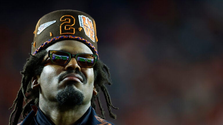 Former Auburn quarterback and NFL player Cam Newton watches a play during the first half of an NCAA college football game against Georgia, Saturday, Oct. 11, 2025, in Auburn, Ala.