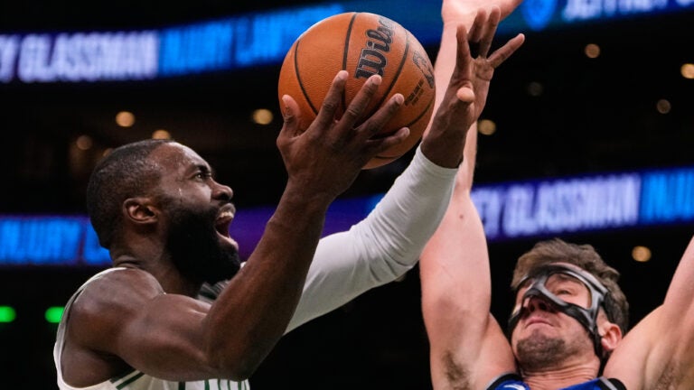 Jaylen Brown's 35 points lead Celtics in a 138-129 victory over the short-handed Magic