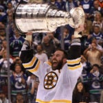 Boston Bruins defenseman Zdeno Chara (33) hoists the Stanley Cup Trophy. The Boston Bruins took on the Vancouver Canucks in Game 7 of the NHL Stanley Cup Finals at Rogers Arena in Vancouver. -