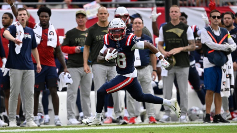 New England Patriots wide receiver Kyle Williams (18) runs for a touchdown on a 72-yard pass play during the first half of an NFL football game against the Tampa Bay Buccaneers, Sunday, Nov. 9, 2025, in Tampa, Fla.