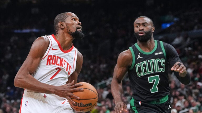 Houston Rockets forward Kevin Durant, left, drives to the basket against Boston Celtics forward Jaylen Brown during the first half of an NBA basketball game, Saturday, Nov. 1, 2025, in Boston.
