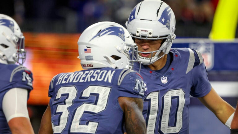 New England Patriots running back TreVeyon Henderson #32 celebrates his rushing touchdown with teammate quarterback Drake Maye #10 against the New York Jets during the second quarter. The New England Patriots played the New York Jets at Gillette Stadium on November 13, 2025.
