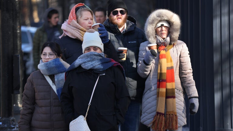Pedestrians bundled up against the cold on Newbury Street in Boston.