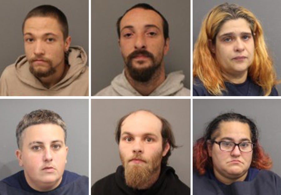 Eight charged after Rhode Island woman found dead in woods