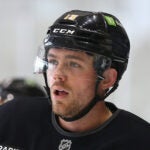 The Bruins training camp continued on Thursday at Warrior Ice Arena. Johnny Beecher takes a breather.