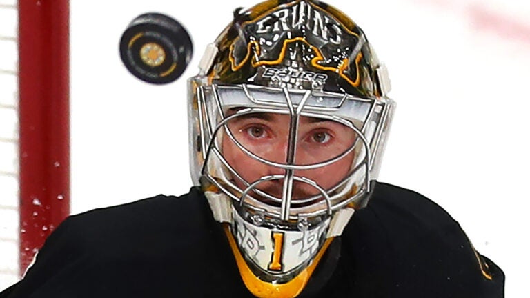 Bruins goalie Jeremy Swayman keeps his eyes on an airborne puck in front of tbhe net in the 1st period.