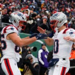 New England Patriots tight end Hunter Henry (left) and quarterback Drake Maye celebrate after connecting for a touchdown during the second quarter. The New England Patriots played the New York Jets at MetLife Stadium on December 28, 2025.