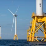 Three of Deepwater Wind's five turbines stand in the water off Block Island, R.I.