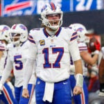 Buffalo Bills quarterback Josh Allen (17) reacts after a touchdown during the second half of an NFL football game against the New England Patriots, Sunday, Dec. 14, 2025, in Foxborough, Mass.