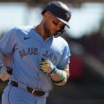Toronto Blue Jays' Bo Bichette rounds third base after hitting a two-run home run in the ninth inning of a baseball game against the Cincinnati Reds, Monday, Sept. 1, 2025, in Cincinnati.