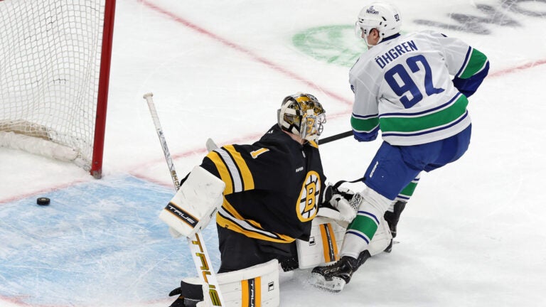 Boston Bruins goalie Jeremy Swayman couldn't stop the puck as the Vancouver Canucks Liam Ohgren scored in the shootout with a goal that eventually gave Vancouver a 5-4 victory during an NHL hockey game, Saturday, Dec. 20, 2025, in Boston.