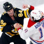 Boston Bruins left wing Tanner Jeannot (84) and Montréal Canadiens right wing Josh Anderson (17) fight right after the puck drop during the first period at TD Garden on Dec. 23, 2025. (