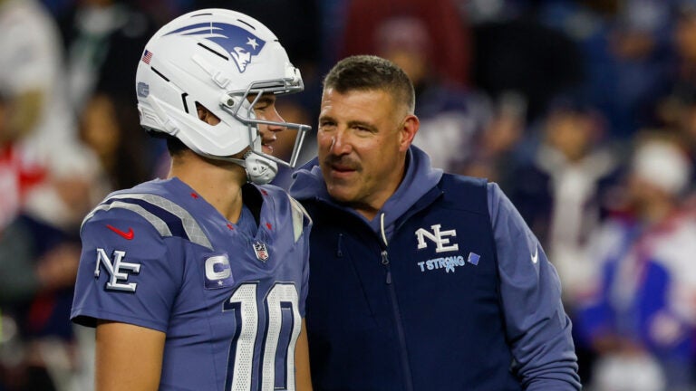 New England Patriots quarterback Drake Maye (10) talks with head coach Mike Vrabel prior to the start of an NFL football game against the New York Jets, Thursday, Nov. 13, 2025, in Foxborough, Mass.