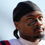 New England Patriots wide receiver Stefon Diggs walks on the field before an NFL football game against the Cincinnati Bengals, Sunday, Nov. 23, 2025, in Cincinnati.