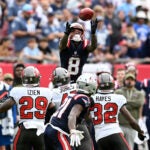 New England Patriots wide receiver Stefon Diggs (8) recovers an onside kick during the second half of an NFL football game against the Tampa Bay Buccaneers, Sunday, Nov. 9, 2025, in Tampa, Fla.