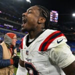 New England Patriots wide receiver Stefon Diggs celebrates as runs off the field after an NFL football game against the Baltimore Ravens, Sunday, Dec. 21, 2025, in Baltimore.