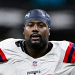 New England Patriots defensive tackle Christian Barmore walks off the field at the end of the first half of an NFL football game against the New Orleans Saints, Sunday, Oct. 12, 2025, in New Orleans.
