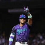 Arizona Diamondbacks' Ketel Marte points to the crowd after hitting a home run against the Philadelphia Phillies during the first inning of a baseball game Friday, Sept. 19, 2025, in Phoenix.