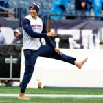 New England Patriots wide receiver Mack Hollins (13) warms up barefoot before the Patriots face the Las Vegas Raiders at Gillette Stadium on Sept. 7, 2025, in Foxborough.