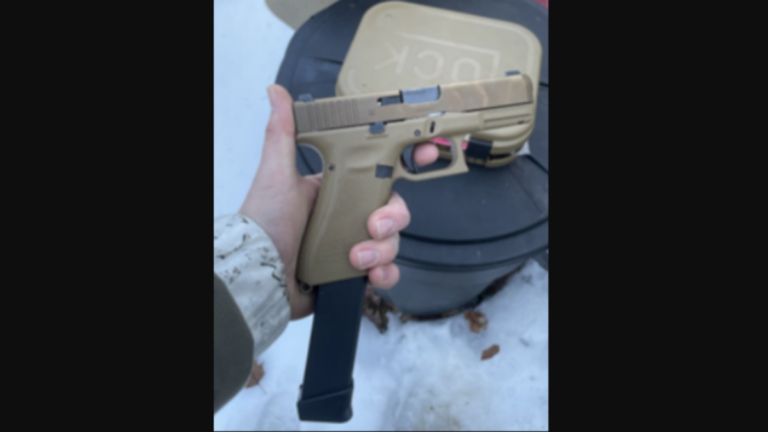 The man pleaded guilty to delivering this 9-millimeter Glock 19X semi-automatic pistol to a co-conspirator.