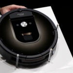 A Roomba 980 vacuum cleaning robot.