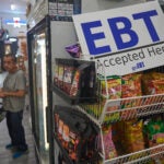 Two men were arrested and charged with fraud Wednesday for allegedly trafficking $7 million in SNAP benefits.