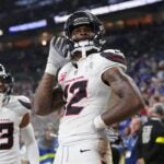 INDIANAPOLIS, INDIANA - NOVEMBER 30: Nico Collins #12 of the Houston Texans celebrates after his rushing touchdown against the Indianapolis Colts during the fourth quarter at Lucas Oil Stadium on November 30, 2025 in Indianapolis, Indiana.