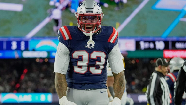 New England Patriots linebacker Anfernee Jennings (33) celebrates a tackle in the first half of an NFL wild-card playoff football game against the Los Angeles Chargers, in Foxborough, Mass., Sunday, Jan. 11, 2026.