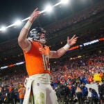 Denver Broncos quarterback Bo Nix (10) celebrates a touchdown in the 4th quarter against the Buffalo Bills in an NFL divisional playoff football game, Sunday, Jan. 18, 2026 in Denver.
