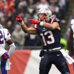 New England Patriots' Mack Hollins celebrates a catch against Buffalo Bills cornerback Tre'Davious White during an NFL football game at Gillette Stadium, Sunday, Dec. 14, 2025 in Foxborough, Mass.