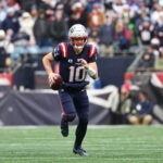New England Patriots quarterback Drake Maye runs against the Buffalo Bills during an NFL football game at Gillette Stadium, Sunday, Dec. 14, 2025 in Foxborough, Mass.