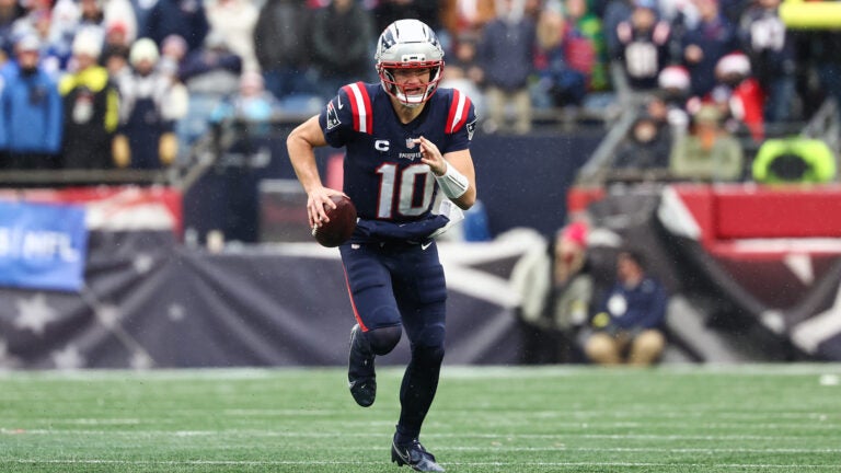 New England Patriots quarterback Drake Maye runs against the Buffalo Bills during an NFL football game at Gillette Stadium, Sunday, Dec. 14, 2025 in Foxborough, Mass.