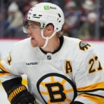 Boston Bruins defenseman Hampus Lindholm (27) in the third period of an NHL hockey game Saturday, Oct. 18, 2025, in Denver.