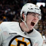 Boston Bruins' Fraser Minten (93) celebrates his game-winning goal against the Vancouver Canucks during overtime in an NHL hockey game in Vancouver, British Columbia, on Saturday, Jan. 3, 2026.