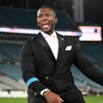 ESPN analyst Ryan Clark broadcasts from the sideline after an NFL football game between the Jacksonville Jaguars and the Kansas City Chiefs, Monday, Oct. 6, 2025, in Jacksonville, Fla.