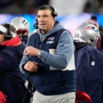 New England Patriots head coach Mike Vrabel stands on the sidelines during the first half of an NFL football game against the Miami Dolphins in Foxborough, Mass., Sunday, Jan. 4, 2026.