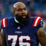 New England Patriots offensive tackle Morgan Moses (76)warms up prior to an NFL football game against the Miami Dolphins, Sunday, Jan. 4, 2026, in Foxborough, Mass.