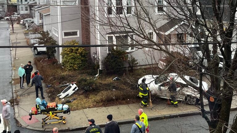 Video shows driver sideswiping houses, falling from car window in Everett