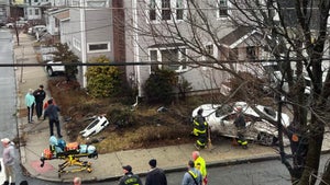 Video shows driver striking homes, falling from car window in Everett
