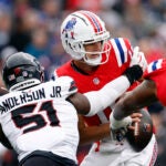 New England Patriots quarterback Drake Maye (10) is sacked by Houston Texans defensive end Will Anderson Jr. (51) during the second quarter at Gillette Stadium.