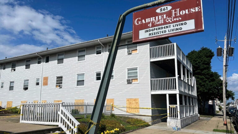 Boards cover the windows of the Gabriel House assisted living facility.