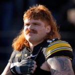 Iowa offensive lineman Gennings Dunker stands on the field before an NCAA college football game against Michigan State, Saturday, Nov. 22, 2025, in Iowa City, Iowa.