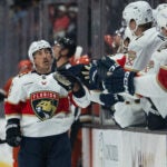 Florida Panthers left wing Brad Marchand (63) celebrates his goal with the bench during the first period of an NHL hockey game against the Anaheim Ducks, Tuesday, Nov. 4, 2025, in Anaheim, Calif.