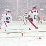 New England Patriots cornerback Christian Gonzalez (0) celebrates his interception in the fourth quarter against the Denver Broncos during the AFC Championship NFL football game, Sunday, Jan. 25, 2026 in Denver.