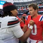 New England Patriots quarterback Drake Maye (10) and Houston Texans quarterback C.J. Stroud (7) meet on the field following an NFL football game, Sunday, Oct. 13, 2024, in Foxborough, Mass.