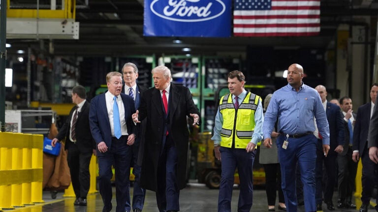 Trump makes obscene gesture at heckler in Ford factory tour