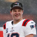 New England Patriots quarterback Drake Maye (10) looks to the crowd as fans chant “MVP” during the AFC Championship trophy presentation. The New England Patriots played the Denver Broncos at Empower Field at Mile High on January 25, 2026.